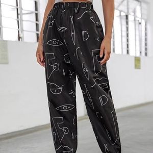 SHEIN graphic windbreaker pants